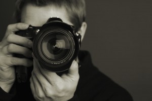 A photographer and DSLR camera
